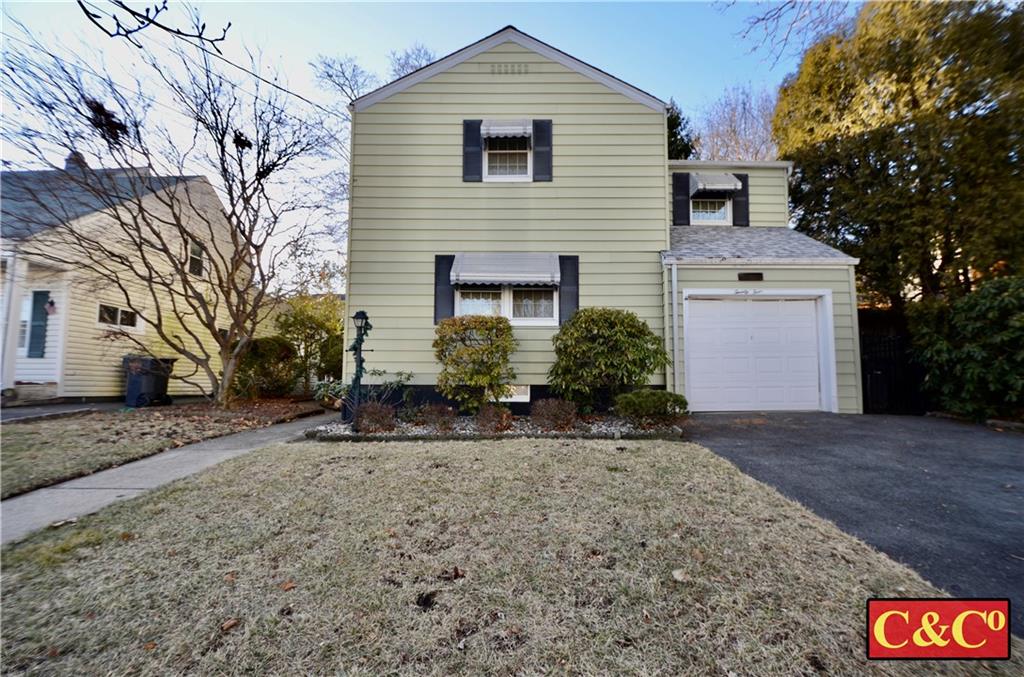 24 Wilbur Road Bergenfield, NJ 07621 - Photo 25 of 27 a front view of a house with garden