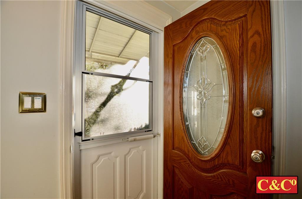 24 Wilbur Road Bergenfield, NJ 07621 - Photo 3 of 27 a view of a entryway with sitting space and a mirror