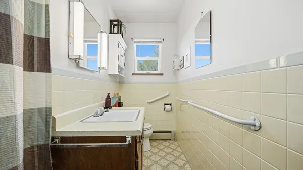 a bathroom with a sink and a mirror