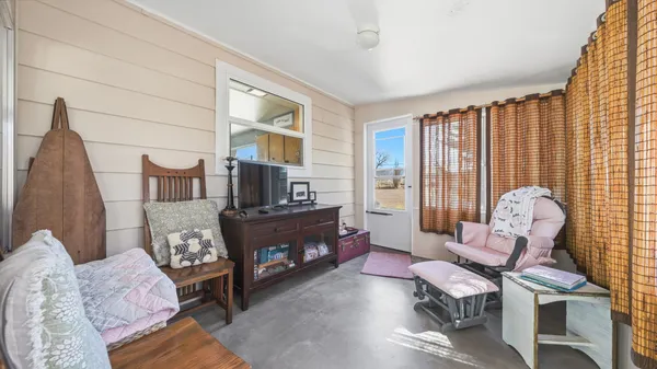 a living room with furniture and a window