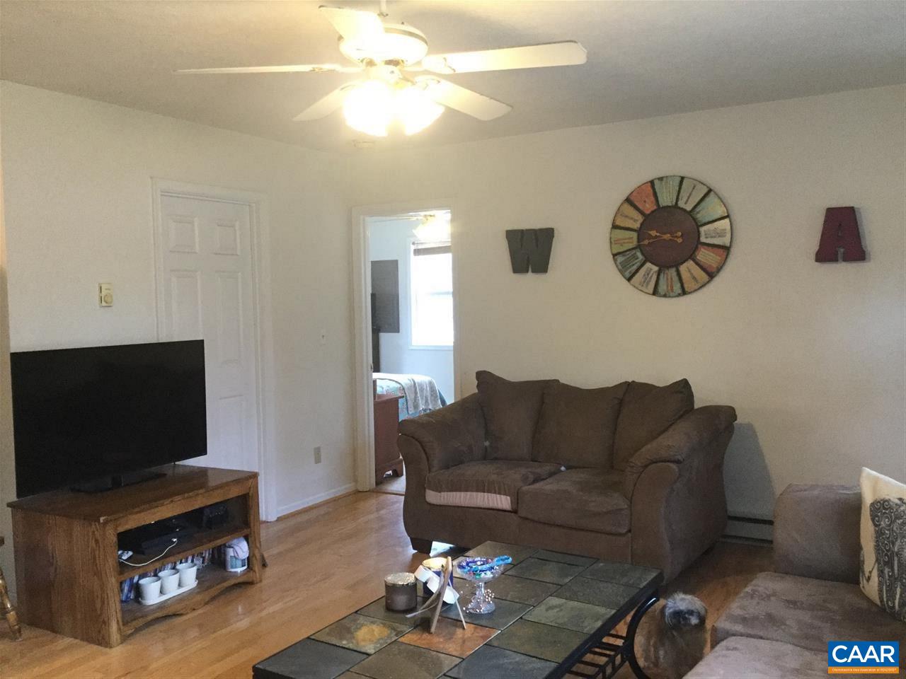 3120 Venable Road Kents Store, VA 23084 - Photo 11 of 15 a living room with furniture and a flat screen tv