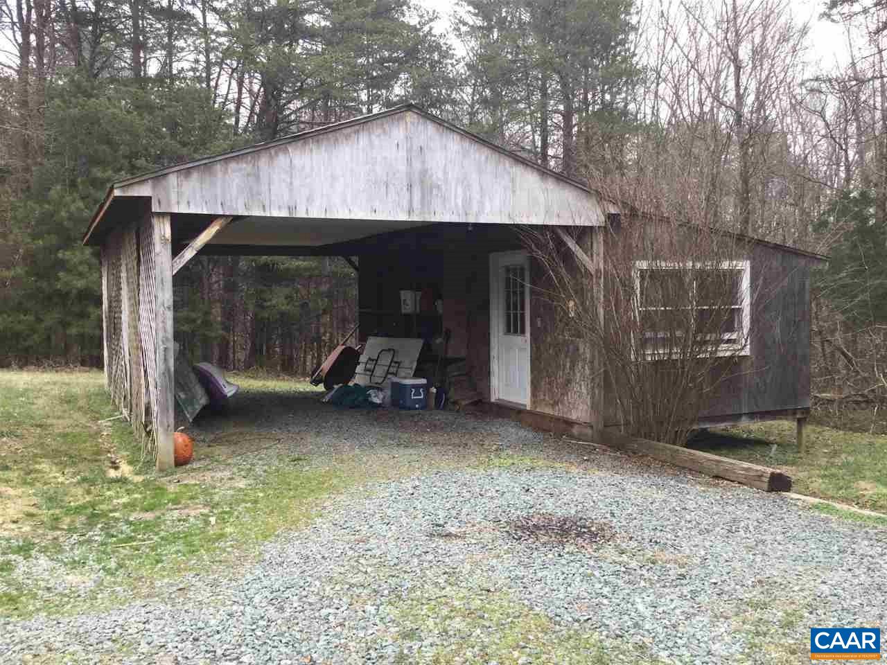 3120 Venable Road Kents Store, VA 23084 - Photo 3 of 15 a view of a small house covered with trees in the background