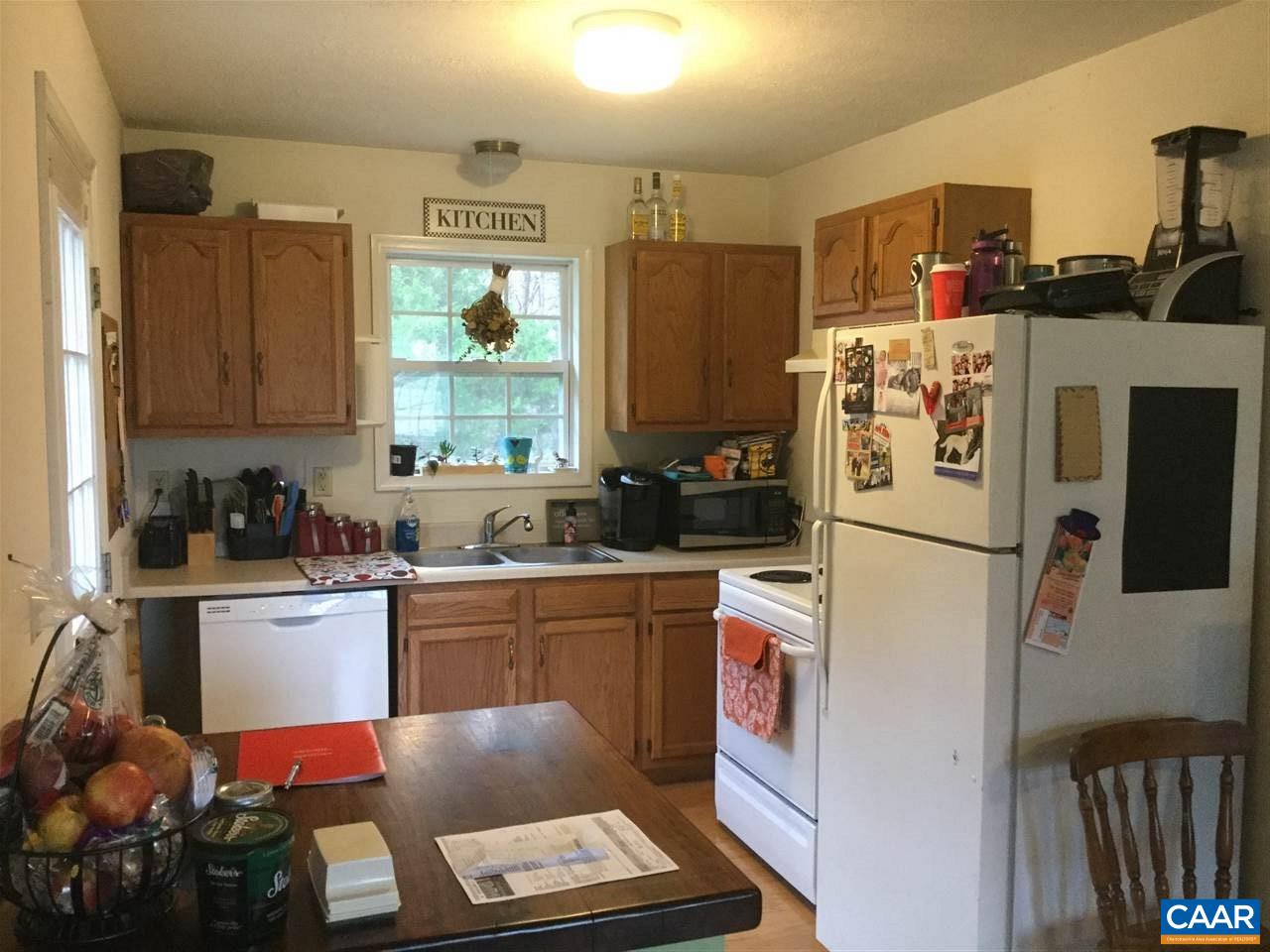 3120 Venable Road Kents Store, VA 23084 - Photo 9 of 15 a kitchen with a refrigerator a stove a microwave and cabinets