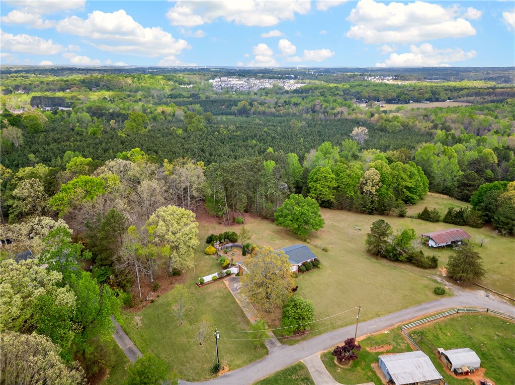 160 Burdette Circle Pendleton, SC 29670 - Photo 34 of 38 An aerial view showcases a residential property surrounded by lush greenery and distant town.