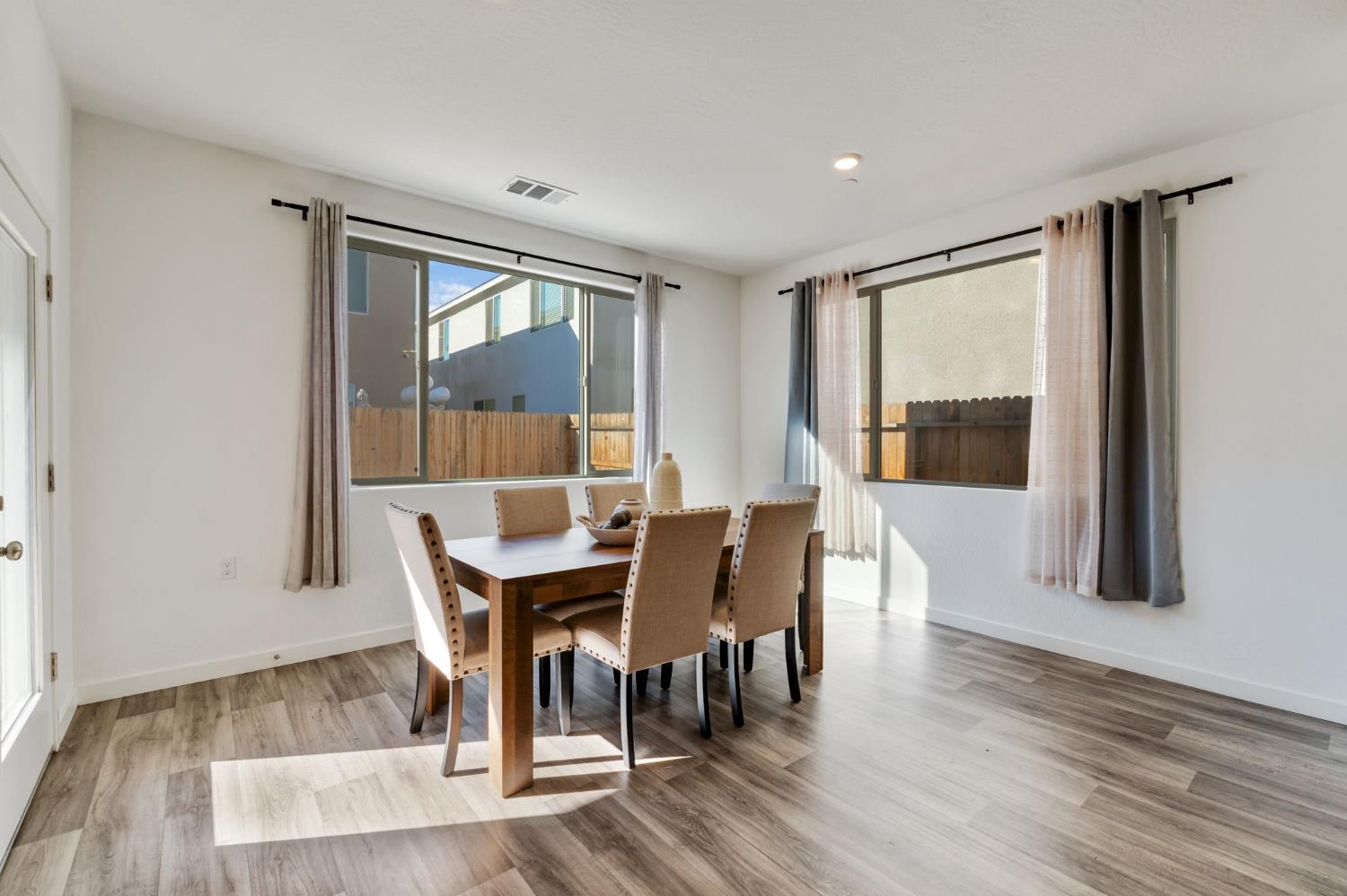 2819 North Redda Road Fresno, CA 93737 - Photo 19 of 57 a view of a dining room with furniture window and wooden floor