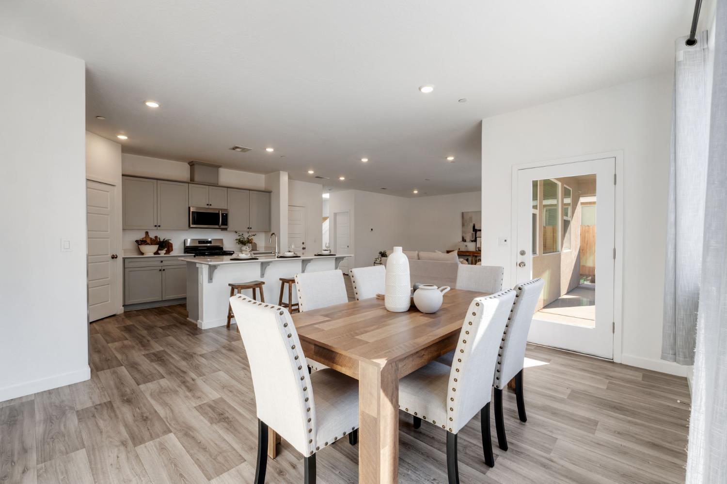2819 North Redda Road Fresno, CA 93737 - Photo 21 of 57 a view of a dining room with furniture and wooden floor