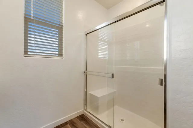 a bathroom with a bathtub and shower