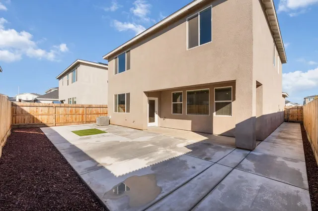 a view of a backyard of the house