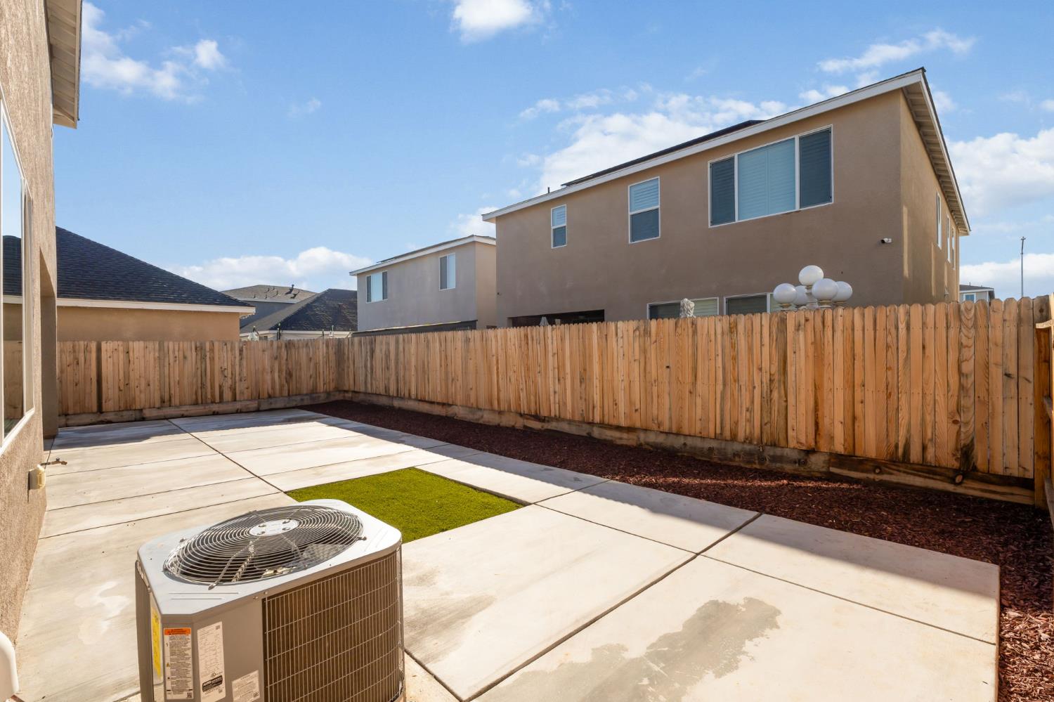 2819 North Redda Road Fresno, CA 93737 - Photo 38 of 57 a backyard of a house with yard and wooden fence