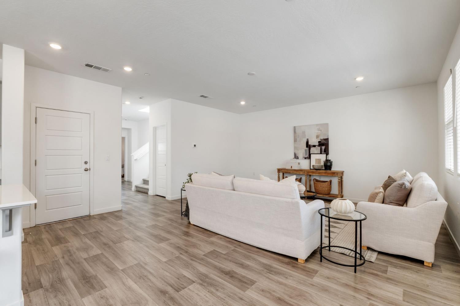 2819 North Redda Road Fresno, CA 93737 - Photo 10 of 57 a living room with furniture and a wooden floor
