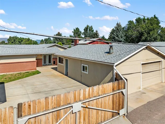 a aerial view of a house with table and chairs