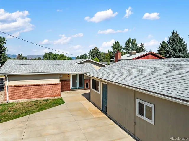 an aerial view of a house with outdoor space