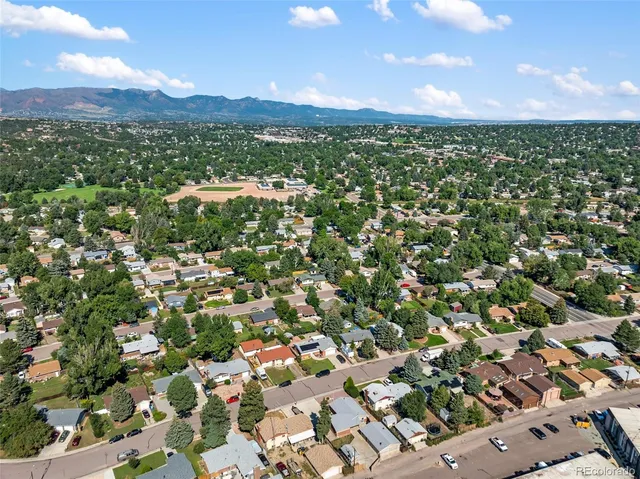 an aerial view of residential houses with outdoor space
