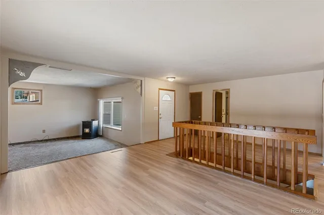 a view of a livingroom with wooden floor