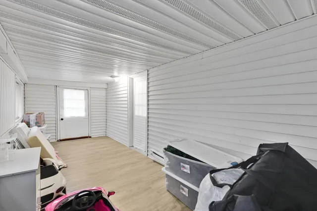 a backyard of a house with table and chairs