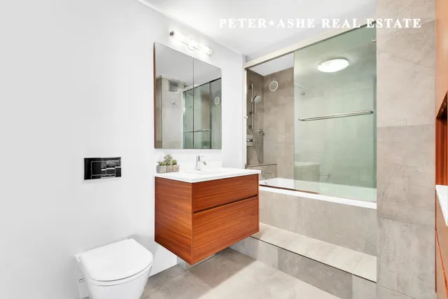 a bedroom with furniture and a book shelf