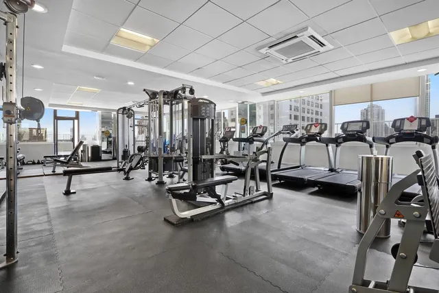 a bathroom with a shower a toilet and sink