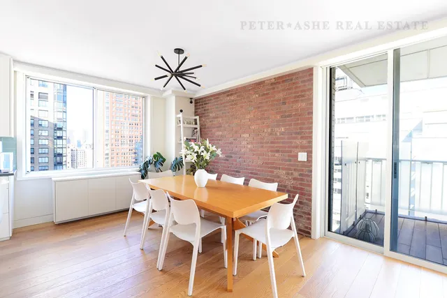a kitchen with stainless steel appliances kitchen island granite countertop a sink and cabinets