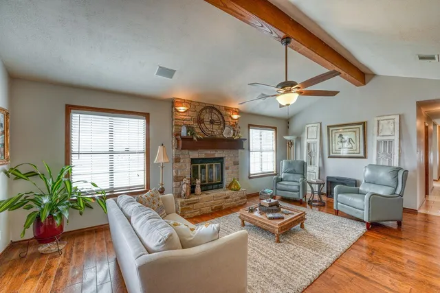 a living room with furniture and a fireplace