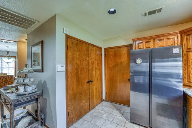 a bathroom with a sink a mirror and a shower