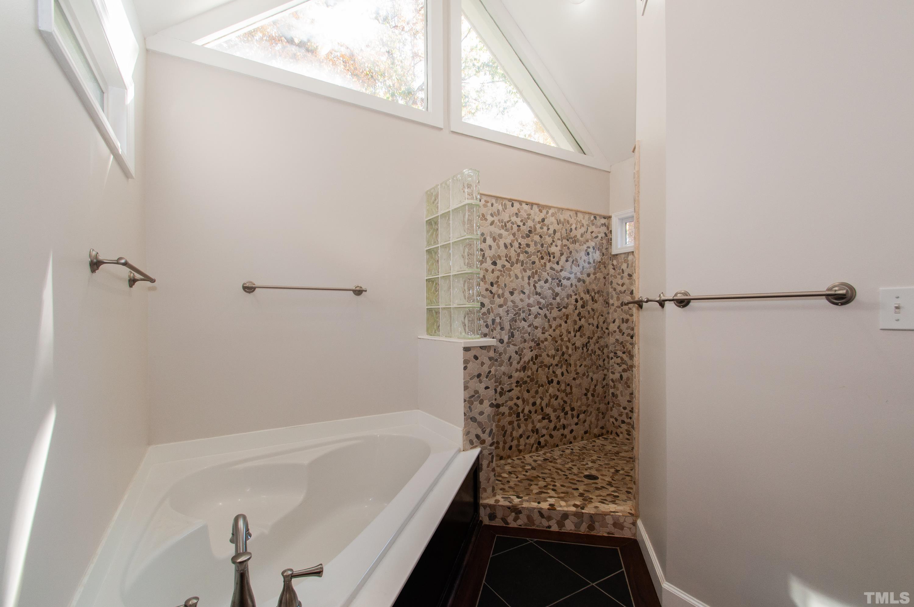 7901 Hepworth Court Raleigh, NC 27615 - Photo 17 of 30 a bathroom with a bathtub