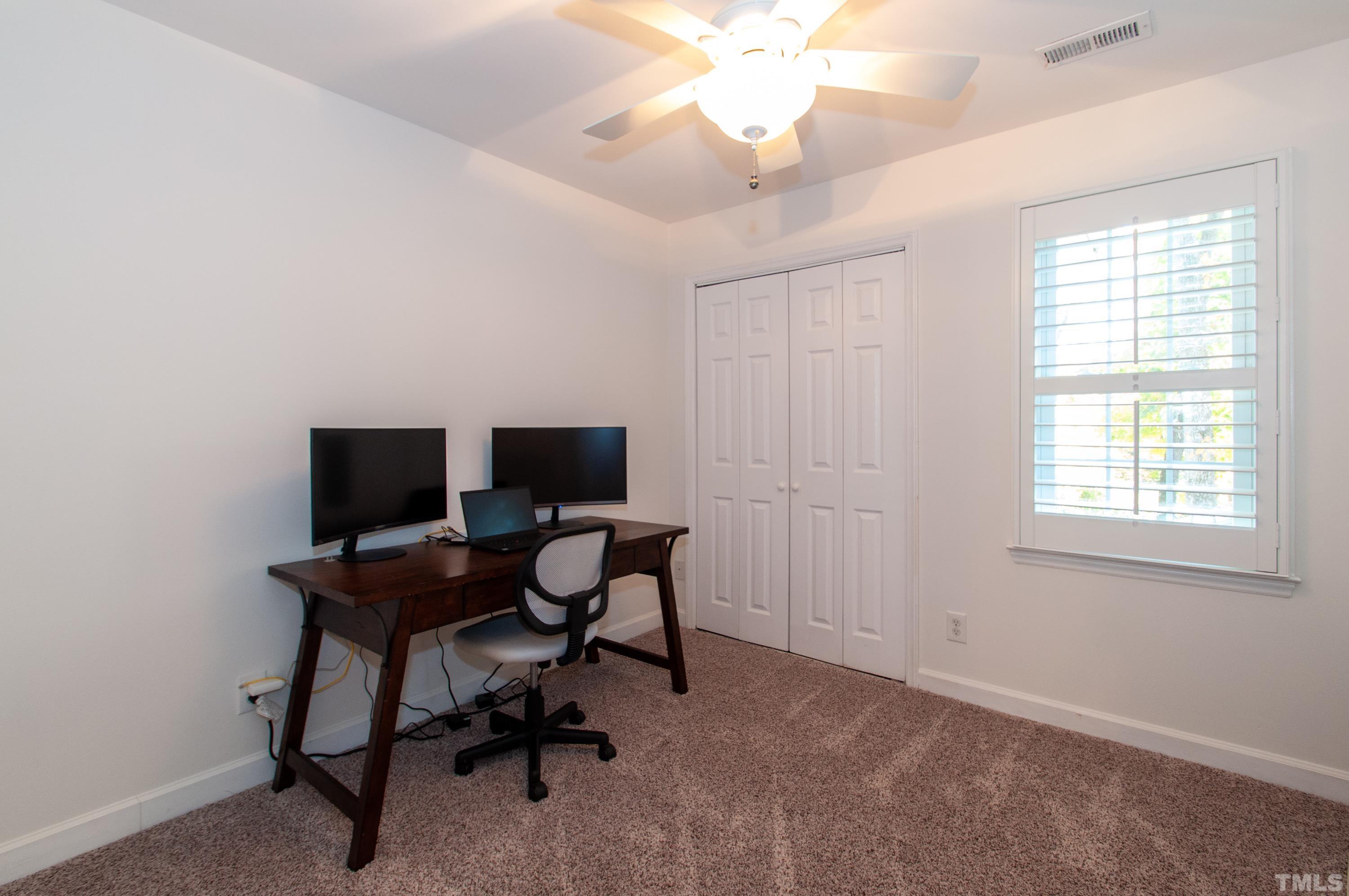 7901 Hepworth Court Raleigh, NC 27615 - Photo 20 of 30 a view of a workspace with furniture and a window