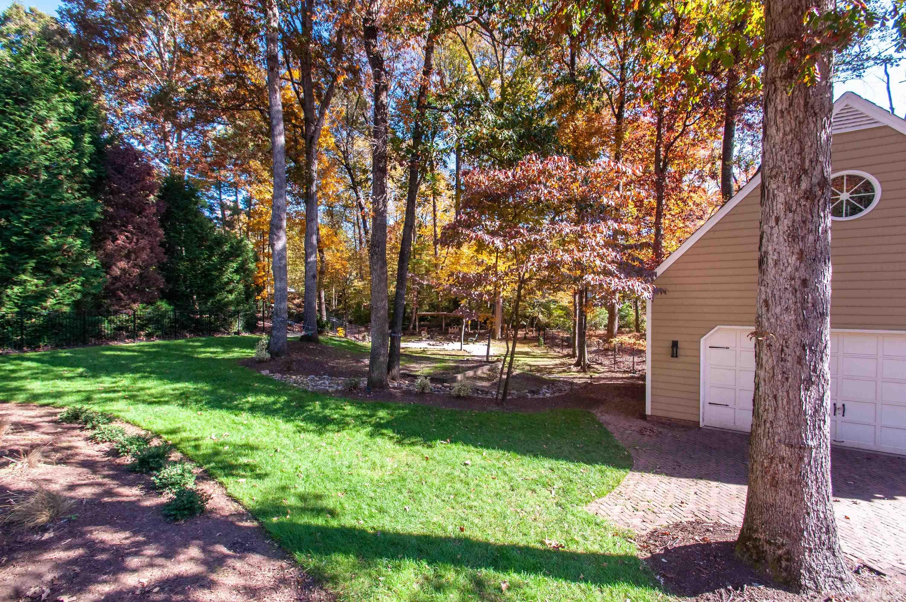 7901 Hepworth Court Raleigh, NC 27615 - Photo 25 of 30 a view of a backyard with large trees