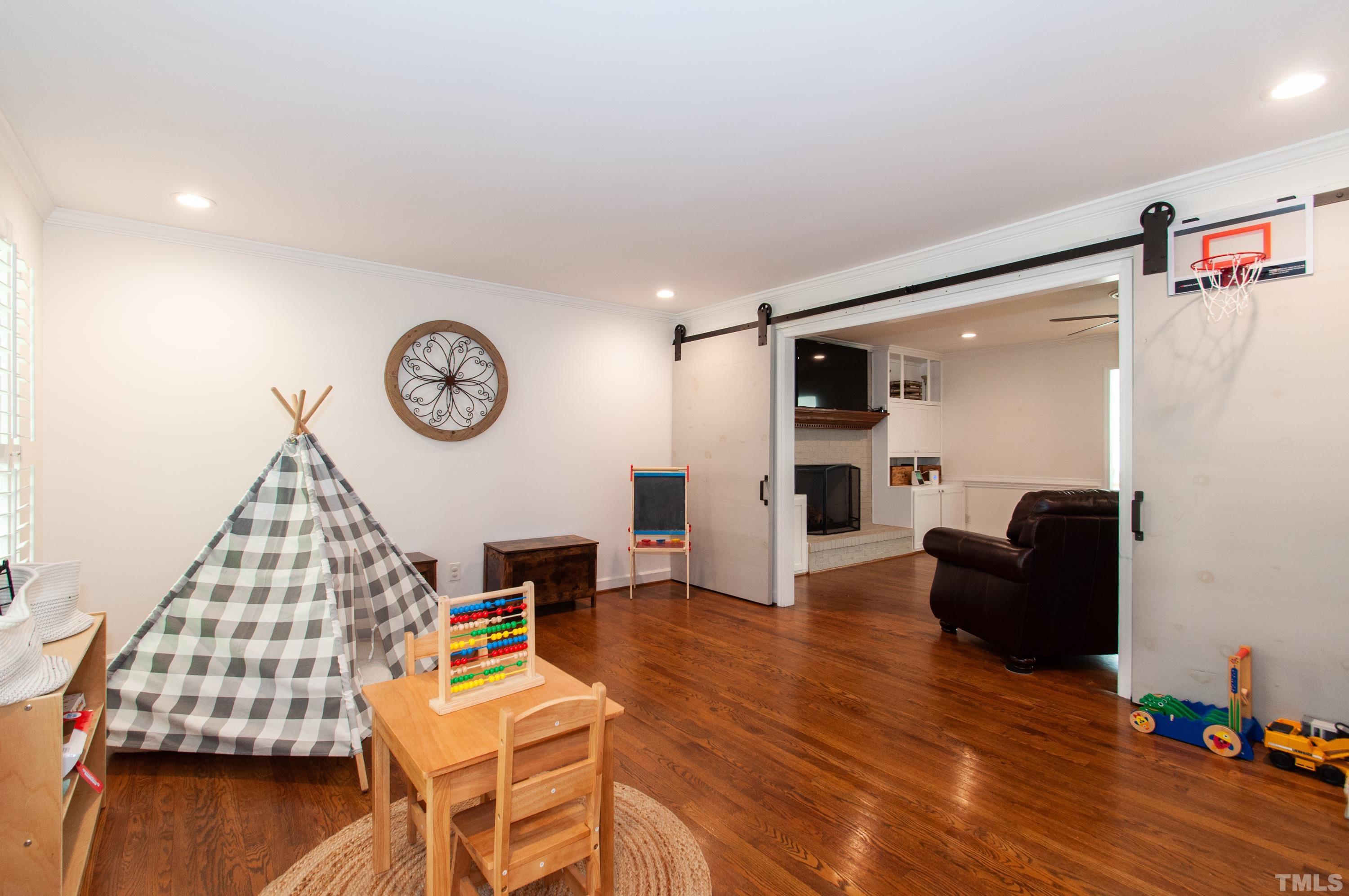 7901 Hepworth Court Raleigh, NC 27615 - Photo 3 of 30 a living room with furniture and a wooden floor