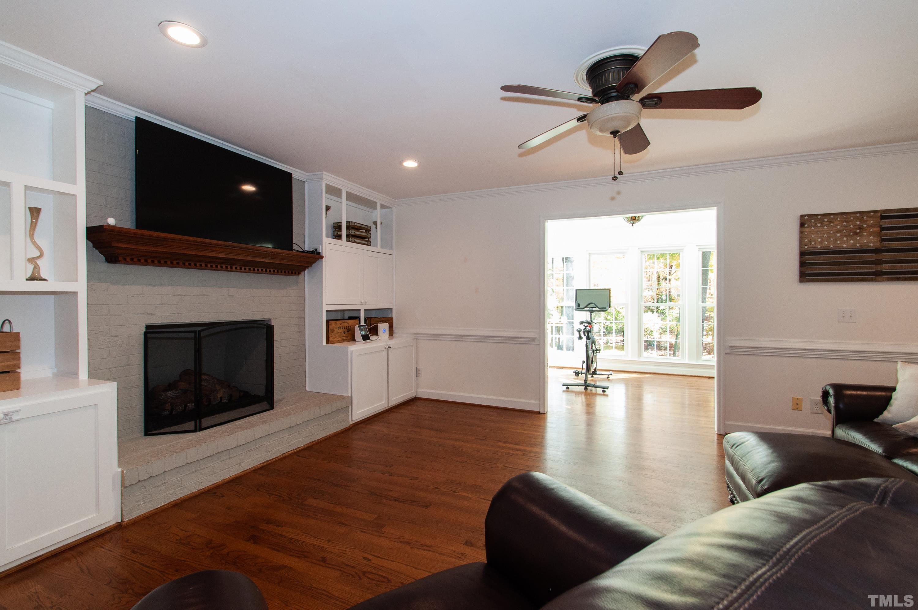 7901 Hepworth Court Raleigh, NC 27615 - Photo 5 of 30 a living room with furniture and a fireplace
