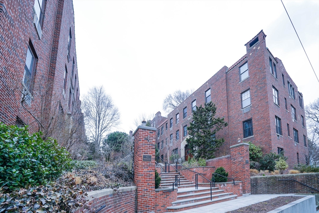 311 Tappan Street, Unit 3 Brookline, MA 02445 - Photo 35 of 35 a view of a brick building next to a yard