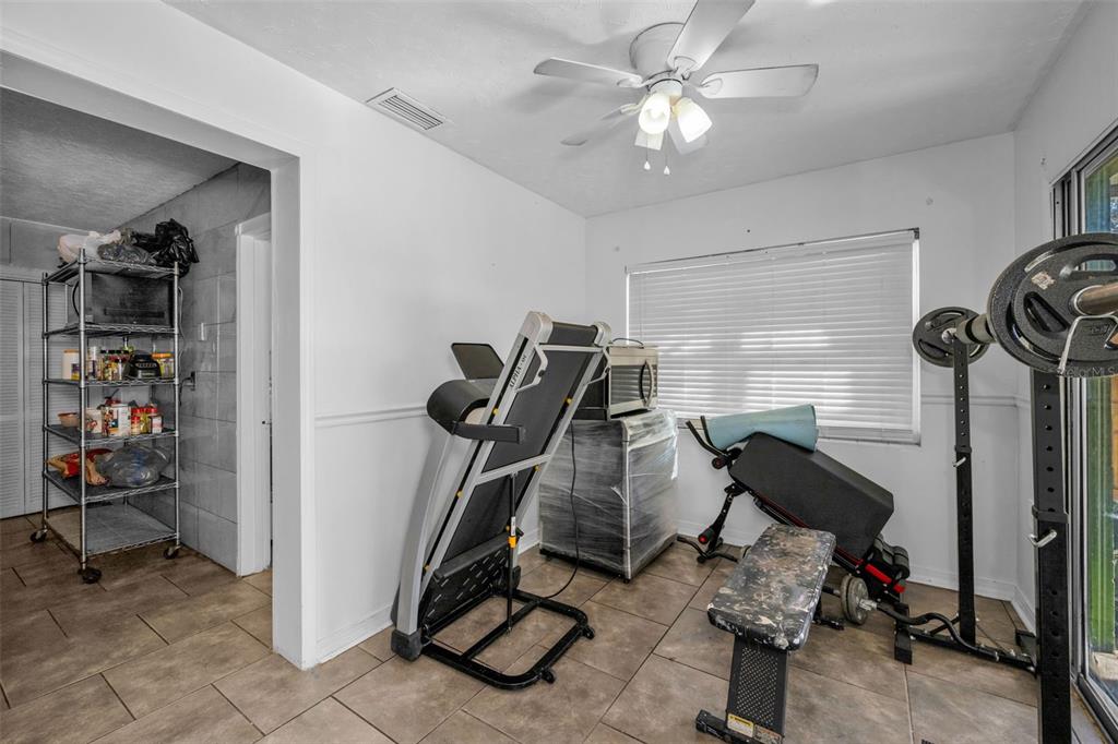 6126 Tennessee Avenue New Port Richey, FL 34653 - Photo 11 of 28 a view of a room with gym equipment