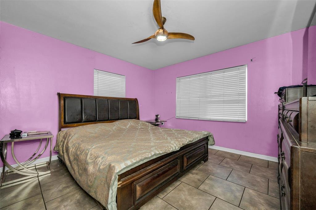 6126 Tennessee Avenue New Port Richey, FL 34653 - Photo 17 of 28 a bed room with a bed and dresser