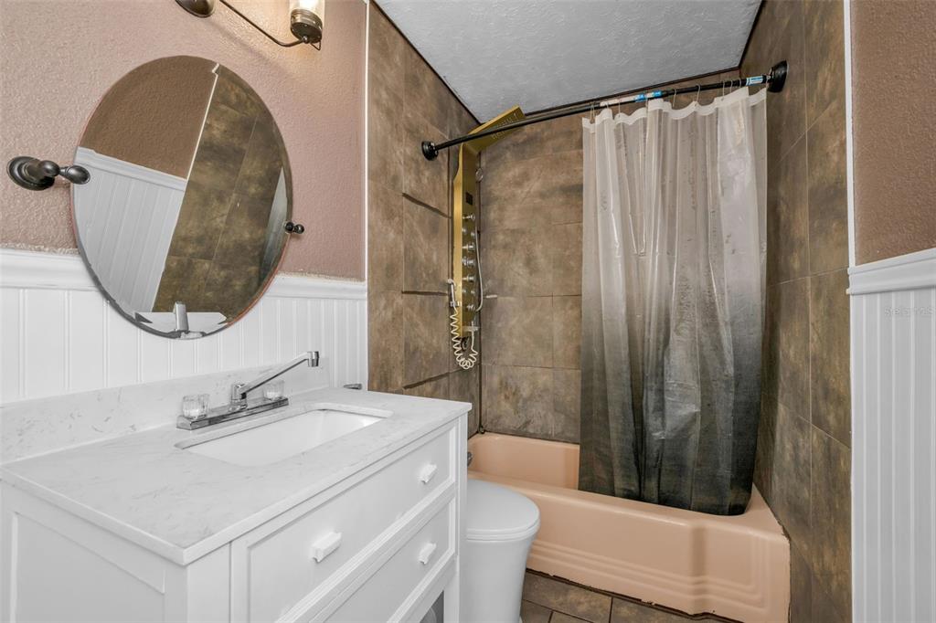 6126 Tennessee Avenue New Port Richey, FL 34653 - Photo 18 of 28 a bathroom with a sink toilet and shower