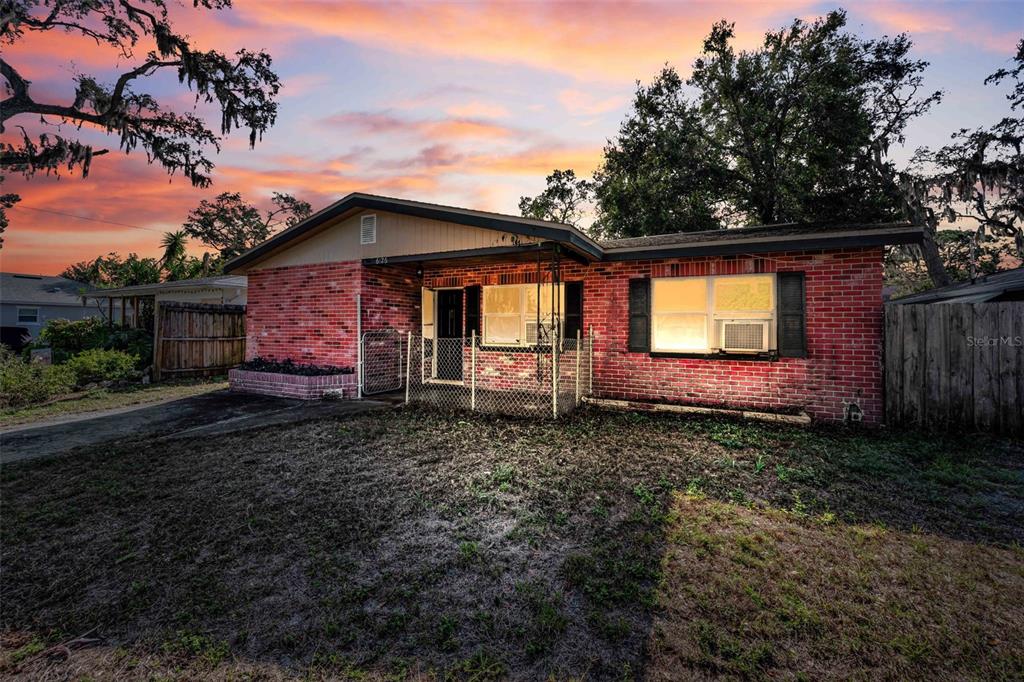 6126 Tennessee Avenue New Port Richey, FL 34653 - Photo 3 of 28 a view of a house with a backyard and a garden