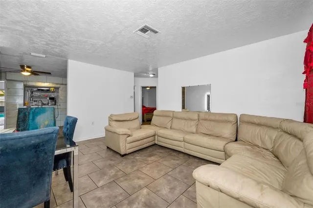 a bathroom with a tub sink and vanity