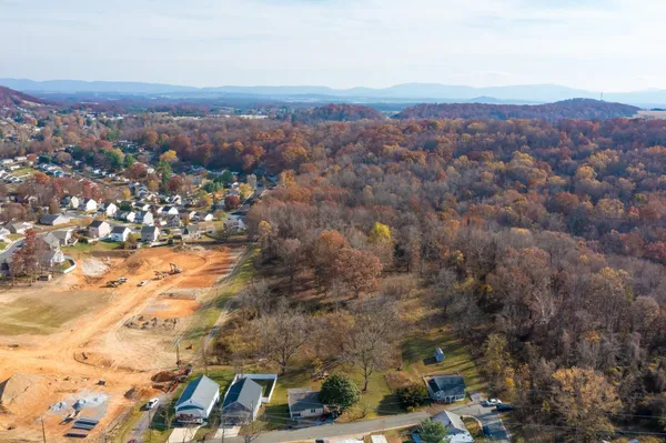 an aerial view of residential houses and city view