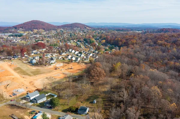 an aerial view of residential house and green space