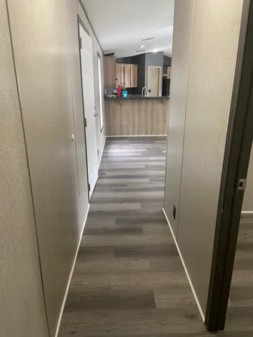 a kitchen with granite countertop a stove sink and cabinets