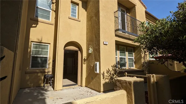 a front view of a house with many windows