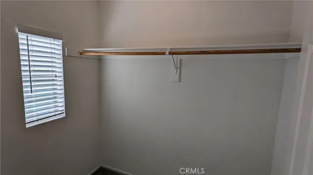 a view of a room with racks on the wall