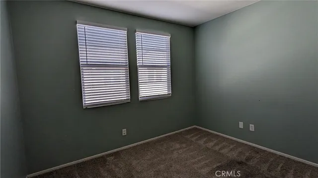 a view of a room that has a window in it