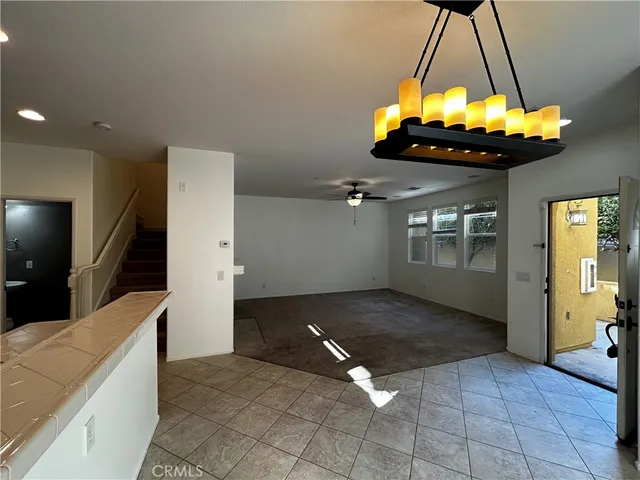 a view of a living room and chandelier