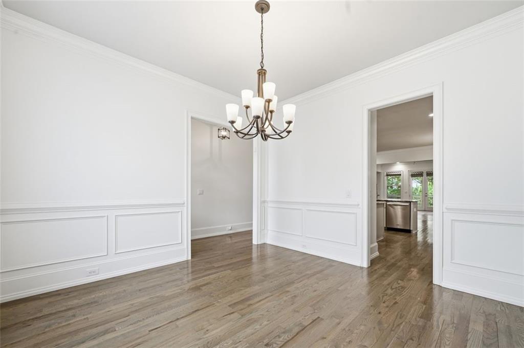 337 Rosshandler Road Suwanee, GA 30024 - Photo 6 of 45 a view of a chandelier in an empty room