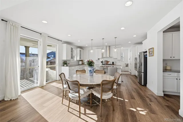 a living room with furniture fireplace and window