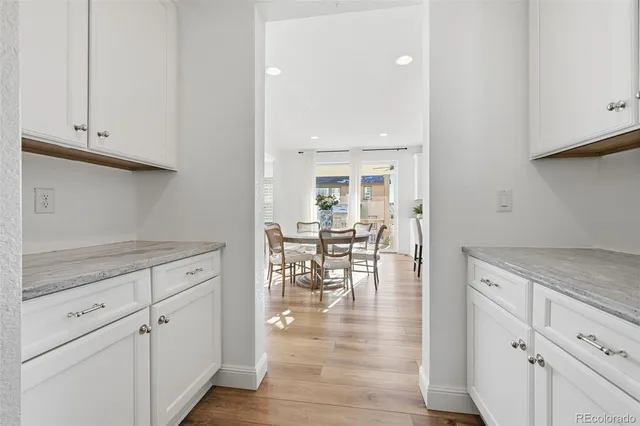 a view of a dining room with furniture and chandelier