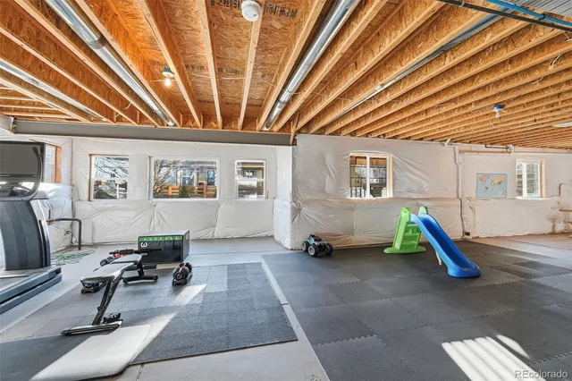 a view of a garage with parked cars