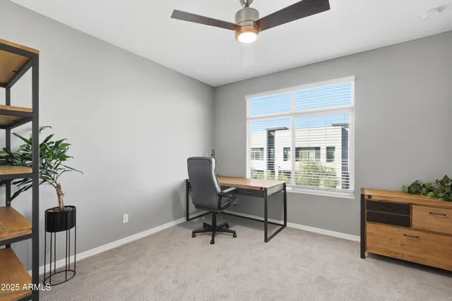 a bathroom with a granite countertop sink a toilet and a mirror