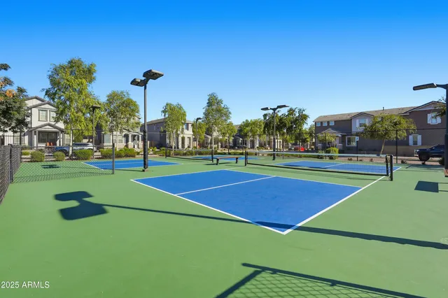 a view of a park with trees and a lake view