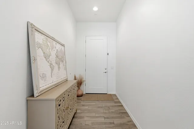a kitchen with stainless steel appliances kitchen island a sink stove and refrigerator