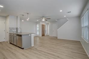 1304 Robin Street Houston, TX 77019 - Photo 4 of 11 Recessed entry, ceiling fan in living area & a half bath for guests.